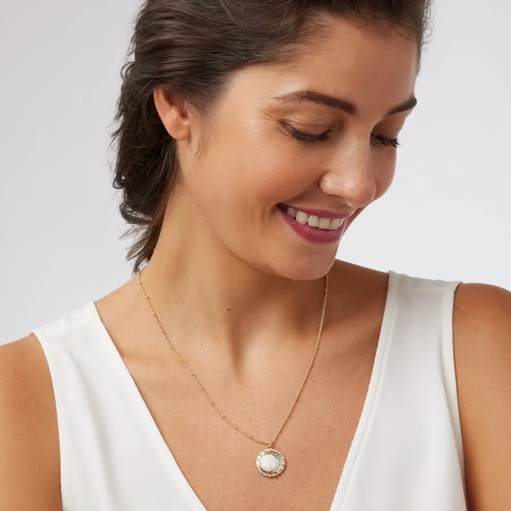 celestial_symbols_carved_motherofpearl_pendant_necklace_1.webp Celestial Symbols Carved Mother-of-Pearl Pendant Necklace*The Met Store Online