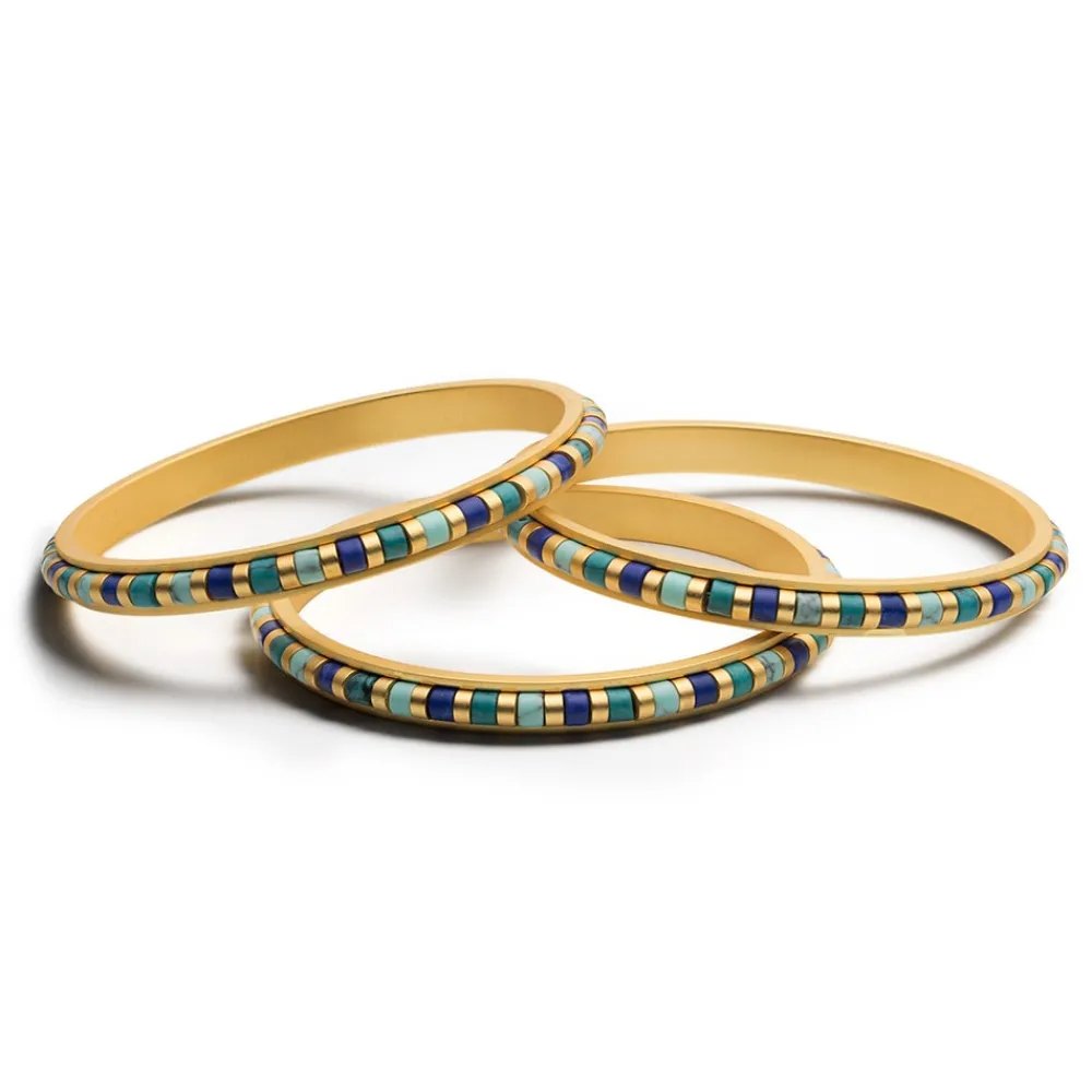 middle_kingdom_cylindrical_bead_bangles_1.webp Middle Kingdom Cylindrical Bead Bangles*The Met Store Fashion