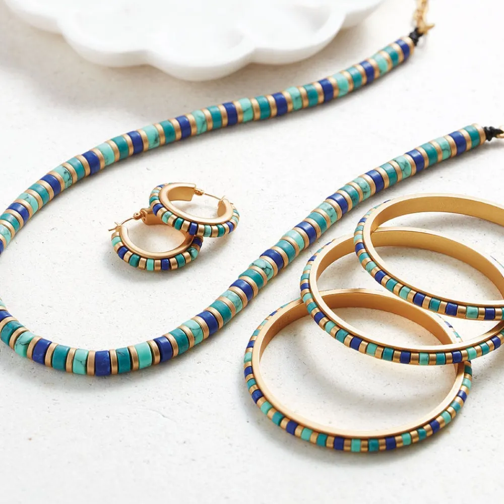 middle_kingdom_cylindrical_bead_bangles_3.webp Middle Kingdom Cylindrical Bead Bangles*The Met Store Fashion